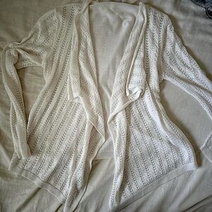 white cardigan with beautiful details and asymmetrical hem
brand: est. 1946